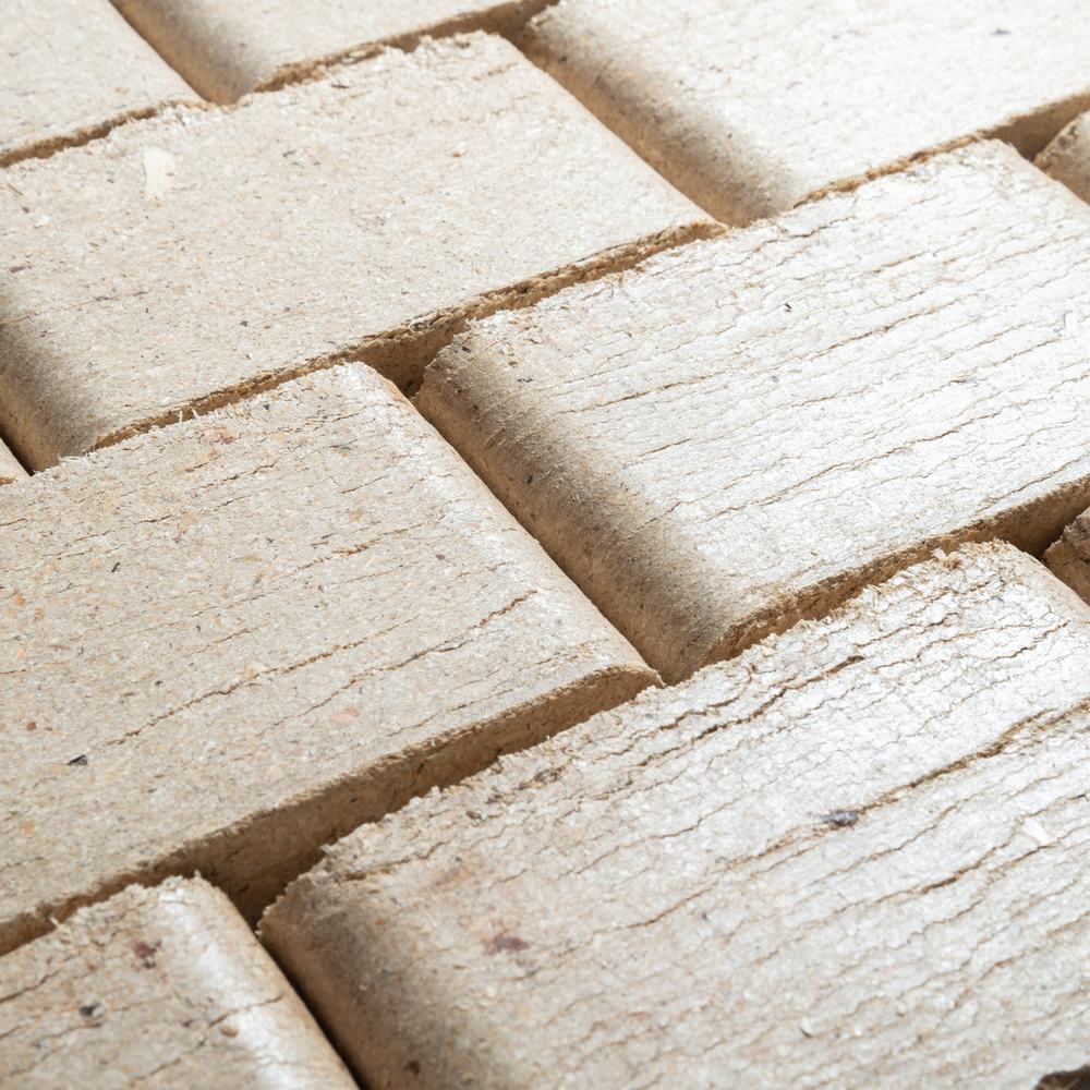 Close-up of stacked biomass briquettes